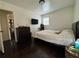 Bedroom with striped bedding and dark wood flooring at 987 Forrest Se Cir, Atlanta, GA 30354