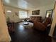Inviting living room with dark wood floors, neutral rug and modern furniture at 987 Forrest Se Cir, Atlanta, GA 30354