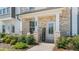 Inviting front entry with brick facade, porch, and welcome sign at 110 Cobalt Dr, Fayetteville, GA 30214