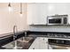 Modern kitchen with stainless steel appliances and granite countertops at 273 12Th Ne St # 114, Atlanta, GA 30309