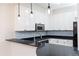 Modern kitchen with stainless steel appliances and granite countertops at 273 12Th Ne St # 114, Atlanta, GA 30309