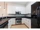 Modern kitchen with stainless steel appliances and white cabinetry at 273 12Th Ne St # 114, Atlanta, GA 30309