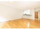 Bright living room with hardwood floors and kitchen bar at 273 12Th Ne St # 114, Atlanta, GA 30309