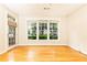 Bright living room with hardwood floors and large windows at 273 12Th Ne St # 114, Atlanta, GA 30309