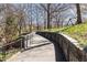 Curved walking path with stone walls and railings at 273 12Th Ne St # 114, Atlanta, GA 30309