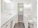 Clean bathroom with white tile and vanity at 558 Plainville Dr, Atlanta, GA 30331