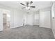 Spacious bedroom with gray carpet and double closets at 558 Plainville Dr, Atlanta, GA 30331