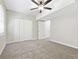 Bright bedroom with gray carpet and double closets at 558 Plainville Dr, Atlanta, GA 30331