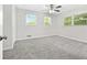 Well-lit bedroom with gray carpet and ceiling fan at 558 Plainville Dr, Atlanta, GA 30331