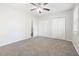 Bright bedroom with gray carpet and ceiling fan at 558 Plainville Dr, Atlanta, GA 30331