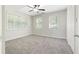 Spacious bedroom with gray carpet and ceiling fan at 558 Plainville Dr, Atlanta, GA 30331