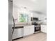 Modern kitchen with stainless steel appliances and granite countertops at 558 Plainville Dr, Atlanta, GA 30331