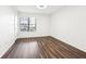 Spacious bedroom with dark brown laminate flooring at 2015 Huntingdon, Atlanta, GA 30350