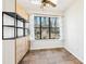 Bright sunroom with tile floors and built-in shelving at 2015 Huntingdon, Atlanta, GA 30350