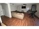 Finished basement with L-shaped sectional sofa, wood flooring and large TV at 4908 Topsfield Ln, Lithonia, GA 30038