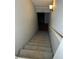 Carpeted staircase leading down to the finished basement at 4908 Topsfield Ln, Lithonia, GA 30038