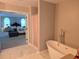 A spa-like bathroom with a soaking tub in view of the bedroom at 4908 Topsfield Ln, Lithonia, GA 30038