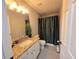 Bathroom featuring granite countertops and a neutral-colored shower curtain at 4908 Topsfield Ln, Lithonia, GA 30038