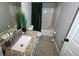 Clean bathroom, granite countertop, bathtub, and shower at 4908 Topsfield Ln, Lithonia, GA 30038