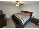 King sized bed, dresser, and ceiling fan in this large bedroom at 4908 Topsfield Ln, Lithonia, GA 30038