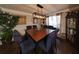 Bright dining room with a large table and hardwood floors at 4908 Topsfield Ln, Lithonia, GA 30038