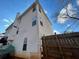 Partial view of the back of the house showing the raised wood deck and siding at 4908 Topsfield Ln, Lithonia, GA 30038