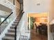 Staircase with white railings and black handrails leading to the second floor at 4908 Topsfield Ln, Lithonia, GA 30038