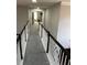 Upper level hallway with carpeted floor and railing at 4908 Topsfield Ln, Lithonia, GA 30038