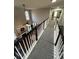 Open upper level hallway overlooking living room at 4908 Topsfield Ln, Lithonia, GA 30038