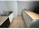 Kitchen with white cabinets, tile floor, and ample counter space at 4908 Topsfield Ln, Lithonia, GA 30038