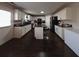 Kitchen with white cabinets, granite countertops and an island at 4908 Topsfield Ln, Lithonia, GA 30038