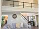 Open living room showcasing high ceilings and a staircase with black handrails at 4908 Topsfield Ln, Lithonia, GA 30038