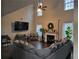 Bright living room featuring vaulted ceilings, a fireplace, and ample natural light from large windows at 4908 Topsfield Ln, Lithonia, GA 30038