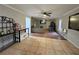 Open living space with tile and hardwood flooring, ceiling fans, and a view of the second living area at 4908 Topsfield Ln, Lithonia, GA 30038