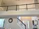 Open living room showcasing high ceilings and a staircase with black handrails at 4908 Topsfield Ln, Lithonia, GA 30038