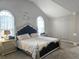 A view of the comfortable main bedroom featuring a decorative accent wall at 4908 Topsfield Ln, Lithonia, GA 30038