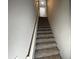 Carpeted stairway leading to the upper level at 4908 Topsfield Ln, Lithonia, GA 30038