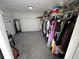 Large walk-in closet with ample shelving and hanging space at 4908 Topsfield Ln, Lithonia, GA 30038