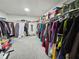 A large walk-in closet providing ample space for clothes and accessories at 4908 Topsfield Ln, Lithonia, GA 30038