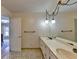 Simple bathroom, featuring a double vanity and updated fixtures at 5762 Lilburn Stone Mountain Rd, Stone Mountain, GA 30087