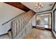 Open dining room with hardwood floors and a view of the kitchen and backyard at 5762 Lilburn Stone Mountain Rd, Stone Mountain, GA 30087