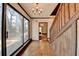 Bright entryway with hardwood floors and a view to the living room and kitchen at 5762 Lilburn Stone Mountain Rd, Stone Mountain, GA 30087