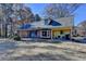 Back of house features a patio and sliding glass doors at 5762 Lilburn Stone Mountain Rd, Stone Mountain, GA 30087