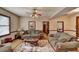 Living room with two sofas, coffee table, and decorative rug at 5762 Lilburn Stone Mountain Rd, Stone Mountain, GA 30087