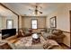 Living room with two sofas, coffee table, and a large TV at 5762 Lilburn Stone Mountain Rd, Stone Mountain, GA 30087