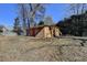 Small storage building with red door in backyard at 5762 Lilburn Stone Mountain Rd, Stone Mountain, GA 30087