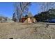 Small storage building with red door in backyard at 5762 Lilburn Stone Mountain Rd, Stone Mountain, GA 30087