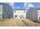 Private backyard with a patio and neighboring houses at 3948 Lake Manor Way, Atlanta, GA 30349