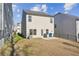 Spacious backyard with patio and neighboring homes visible at 3948 Lake Manor Way, Atlanta, GA 30349