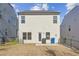 Private backyard with a patio and neighboring houses at 3948 Lake Manor Way, Atlanta, GA 30349